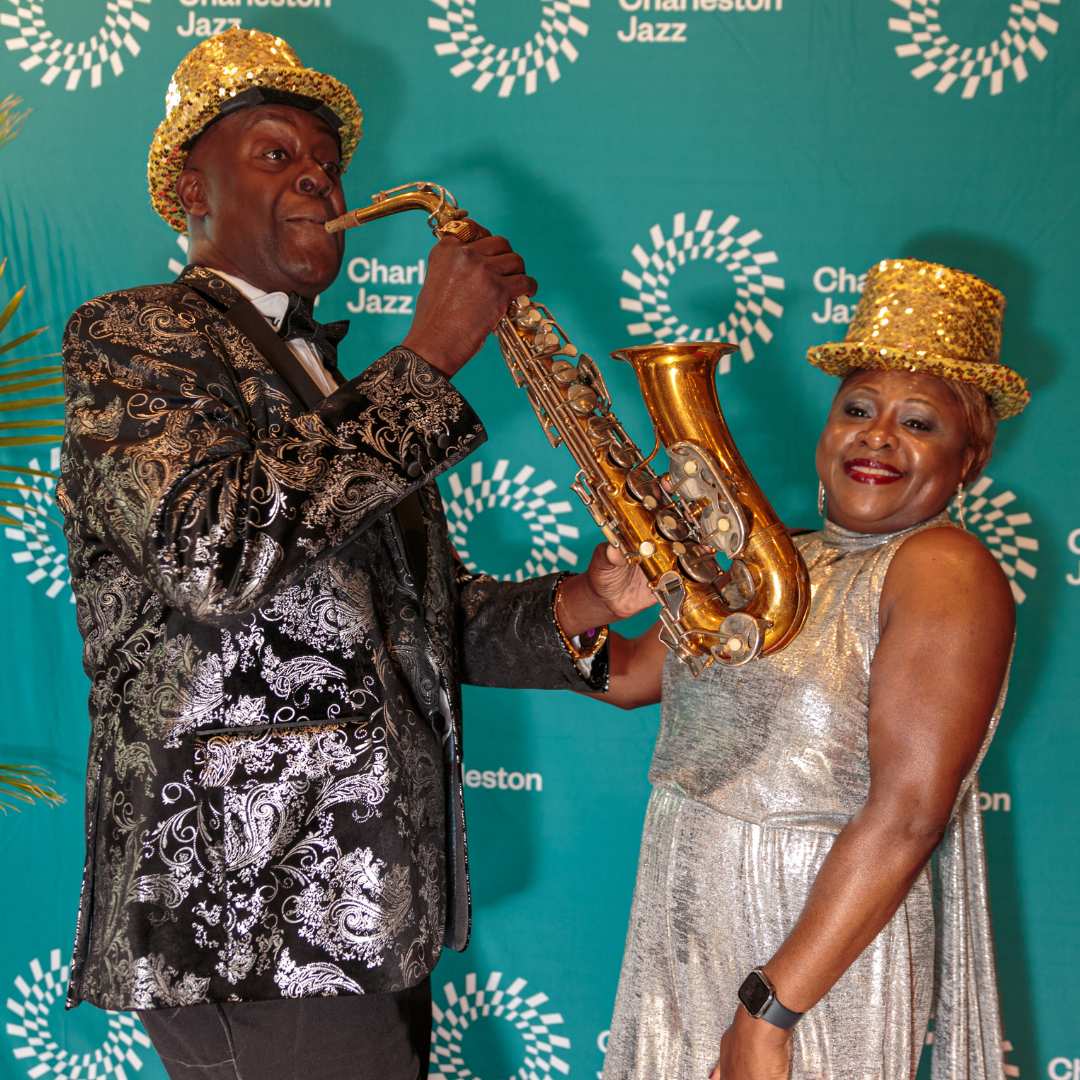 Man and woman playing jazz instruments wearing gold top hats