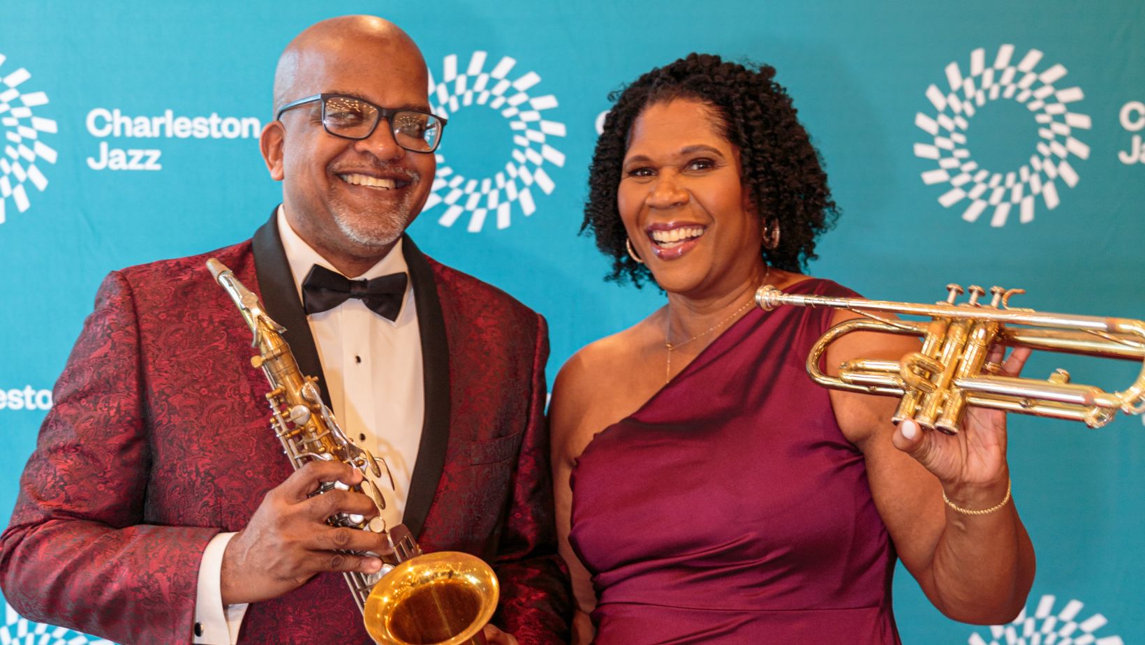Man and woman at Charleston Jazz gala posing with instruments